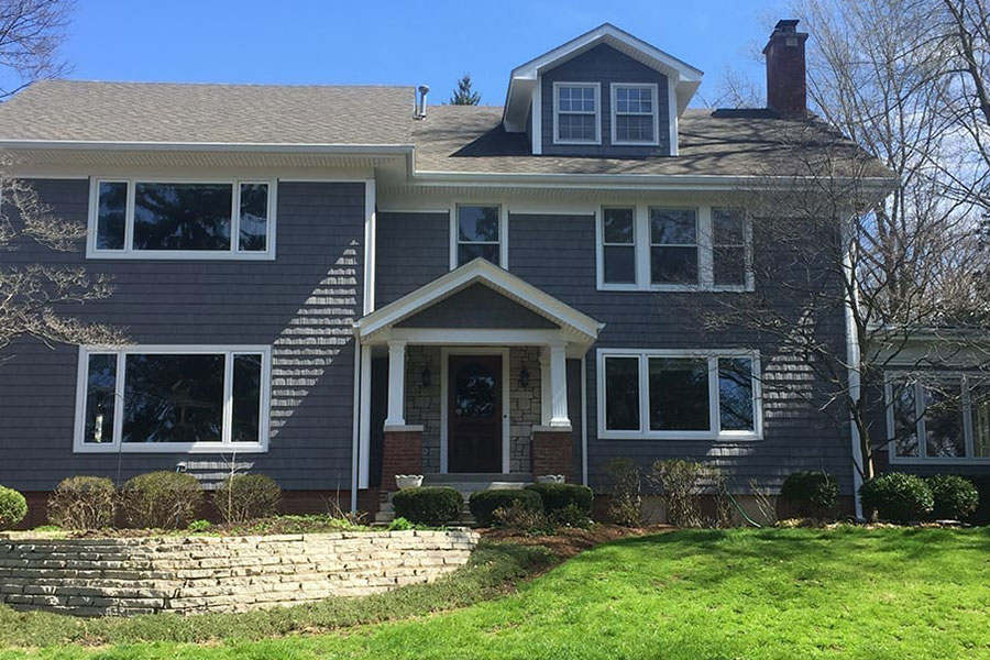 The front of a residential home in Chatham, IL, with a variety of window installations.