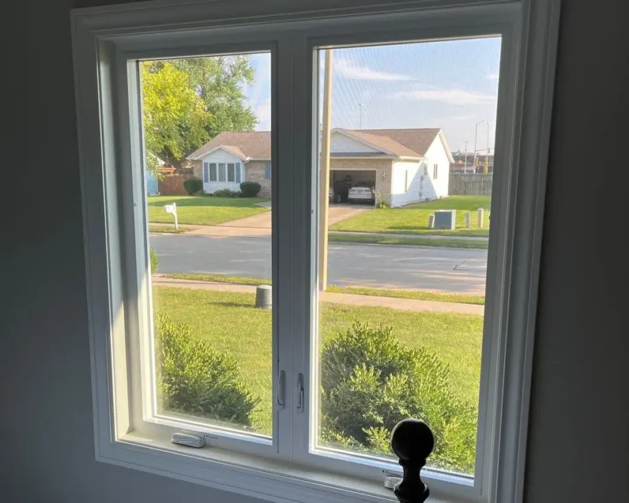 This is a photo of a newly installed ProVia Window by Sutton’s in Springfield, IL in a bedroom with a view of the outdoors.