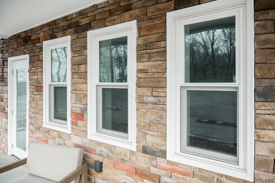 This is a photo of Endure White Double Hung Windows on a front porch in Sherman, IL.