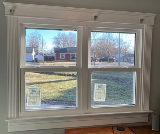 This is a photo of windows in a house in Springfield, IL installed by Sutton’s Inc. during the winter.